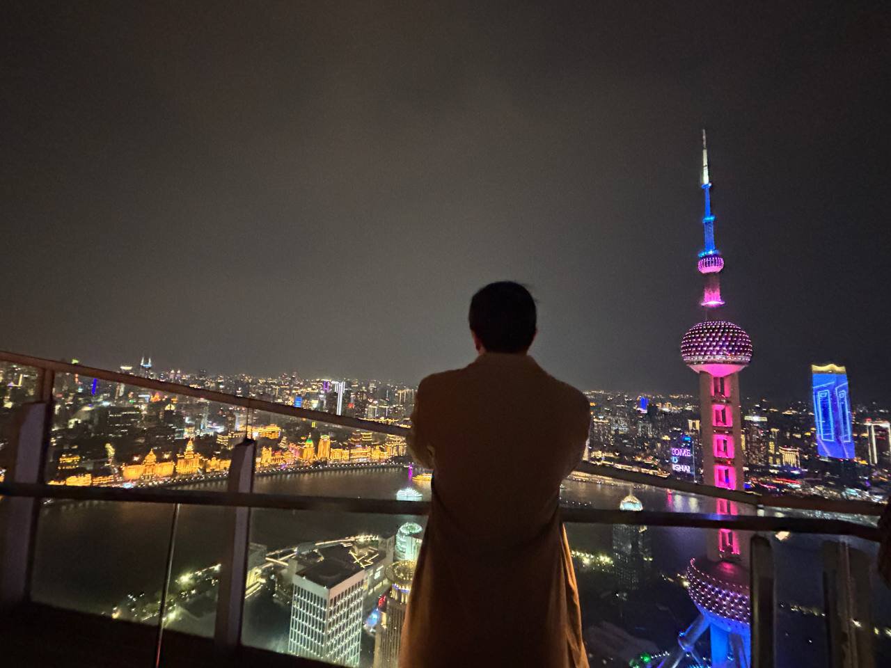 Ritz-Carlton Hotel rooftop in Shanghai skyline with view of Oriental Pearl Tower